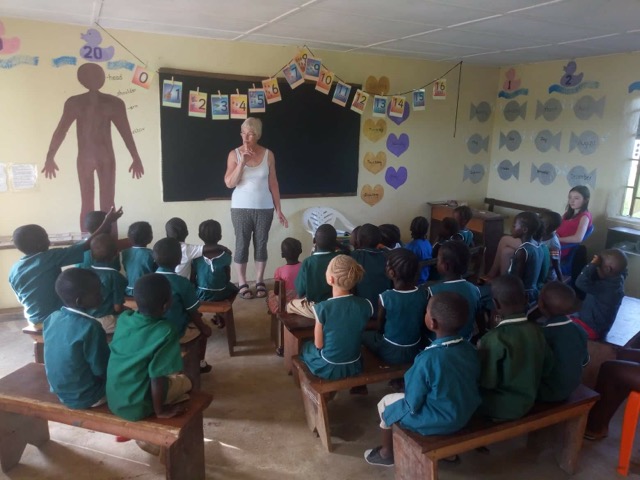 Janet teaching class of children